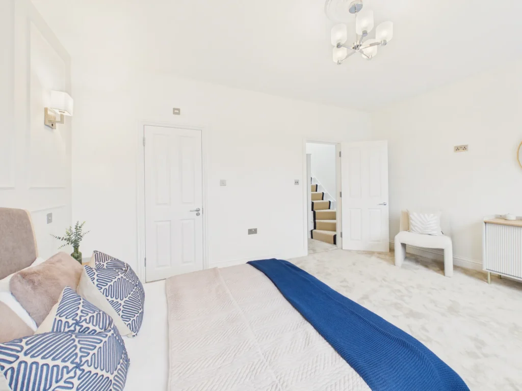 First-floor master bedroom looking through to the landing and the staircase up to the loft